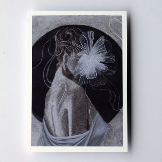 A monochrome figurative artwork showing a draped human torso and arm against a dark oval, with a large luminous flower-like form in the hair and fine flowing lines around the figure. The piece is rendered in grayscale tones on a square canvas with a white border around it.