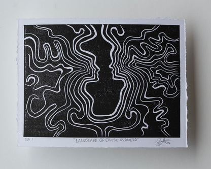 A black and white art print titled "Landscape of Consciousness" featuring 2 abstract face profile made of white contour lines on a black background, photographed with a white paper border